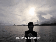 a man in the water with the words morning sunshine