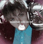 a picture of a young man with the words woochan solo de fefi on the bottom
