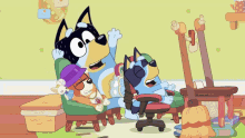 a group of cartoon dogs are sitting on a couch