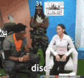 a man and a woman are sitting in front of a sign that says disc