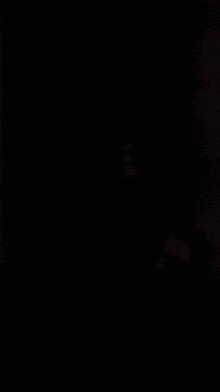 a woman in a white bra is sitting on the floor