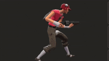a man in a red shirt is holding a gun and pointing at it