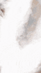 a close up of a waterfall with smoke coming out of the water