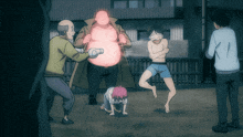 a group of people are standing around a man with a pink light on his chest