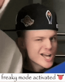 a man wearing a black hat with the word freaky mode activated below him