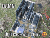 a computer motherboard is sitting on the grass with a meme that says `` damn that esex was crazy '' .