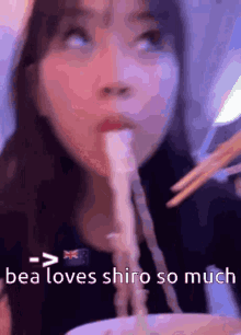 a woman is eating noodles with chopsticks and the caption reads " bea loves shiro so much " .