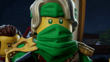 a lego figure with a green scarf around his neck
