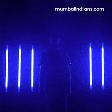 a man in a blue shirt that says mumbai indians on it