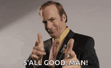 a man in a suit and tie is giving two thumbs up and says s ' all good man .