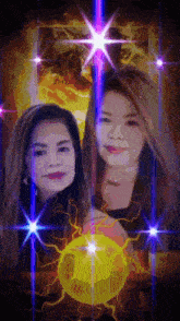 two women are standing next to each other in front of a yellow ball