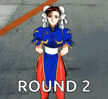 a woman in a blue and red outfit is standing in front of the words round 2