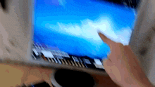 a blurry picture of a person using a laptop computer