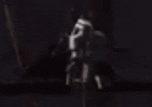 a blurry picture of a person standing on the side of a road in a video game .