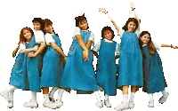 a group of young girls wearing blue dresses are posing for a photo