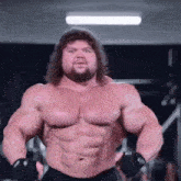a very muscular man with long hair and a beard