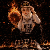 a woman in a hijab is holding a basketball and wearing a jersey that says ipeh