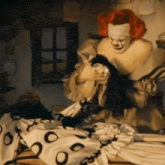 a man in a clown costume is holding a piece of cloth