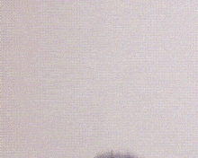 a cartoon character with blue hair and a maid outfit is standing in front of a white wall .