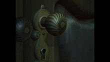 a hand in a white glove is reaching for a door handle