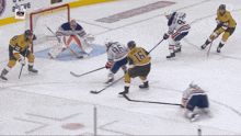a hockey game is being played in front of an advertisement for jersey mikes