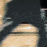 a blurry picture of a person 's face with a black shirt