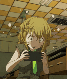 a girl with a green tie is playing a game on her phone