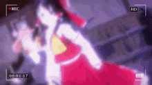 a recording of a woman in a red dress is being recorded in hd 2k