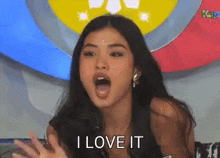a woman is saying i love it with her mouth wide open