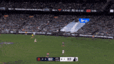 a soccer game is being played with the score 62 to 63