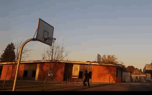 a basketball hoop in front of a building with a sign that says ' a '