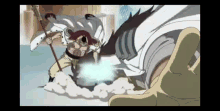 a man in a white robe is holding a sword and fighting a giant monster .