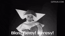 a nun says blasphemy heresy on a black background