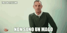 a man in a green sweater is making a funny face and says non sono un mago