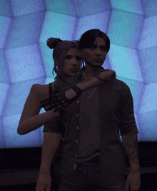 a man and a woman are posing for a picture in front of a purple wall