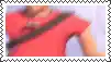 a stamp with a picture of a man in a red shirt and a black belt .