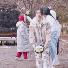 a girl holding a star volleyball in her hands