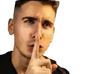 a man is making a shhh gesture with his finger to his lips
