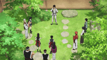 a group of people are standing in a circle on a grassy area