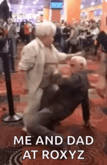 a man and a woman are dancing together in a casino .