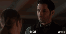 a man is talking to a woman and says no