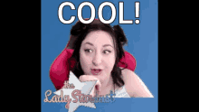 a woman is sitting in a red chair with the words cool on the screen behind her