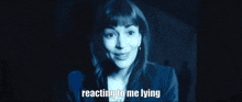 a close up of a woman 's face with the words reacting to me lying next to her