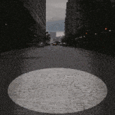 a circle in the middle of a cobblestone street with a sign that says " no parking "