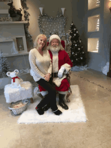 Merry Christmas Santa Claus GIF - Merry Christmas Santa Claus Sitting On Santas Lap GIFs