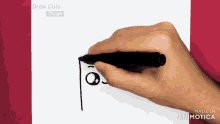 a hand is holding a marker in front of a screen that says draw cute things on it