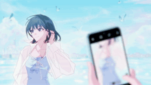 a person is taking a picture of a girl with their phone