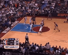 a basketball game is being played in front of a crowd and the scoreboard shows that det leads 3-1