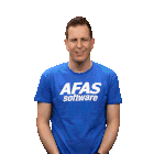 a man wearing a blue afas software shirt applauds