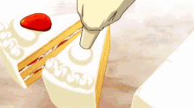 a person is putting a strawberry on a slice of cake